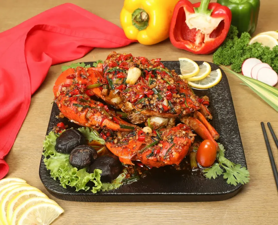 A platter of cooked shellfish and vegetables
